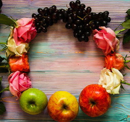 Wreath made of roses, grapes and apples