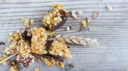 Healthy cereal bars on wood background