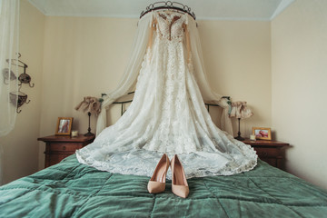 Wedding dress hanging in bridal suite