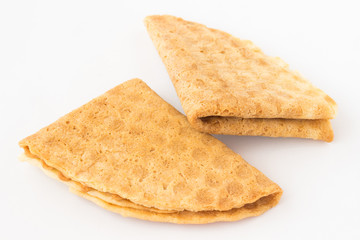 Homemade cookies in the shape of a triangle on  white background