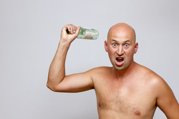 Fototapeta premium Drunk man with a bottle in his hand