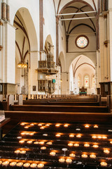 Riga, Latvia. Candles In The Riga Dom Dome Cathedral. Interior