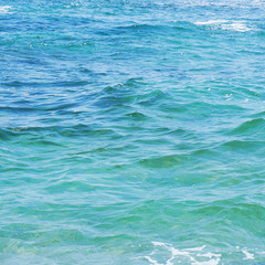 Texture of turquoise calm sea surface