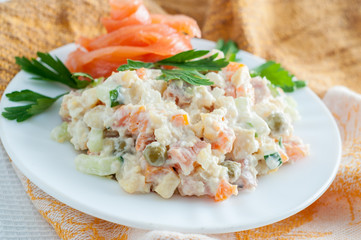 Russian salad Olivier on a white plate
