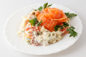 Russian salad Olivier on a white plate