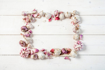 Garlic. Garlic Cloves and Garlic Bulb on a wooden vintage rustic table. Top View. Frame