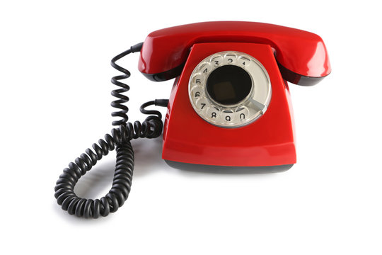 Red retro telephone isolated on a white
