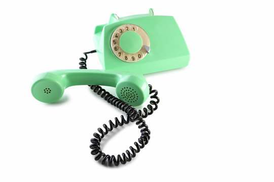 Green retro telephone isolated on a white