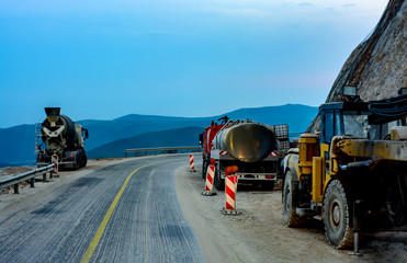 Construction machines on a mountain road.