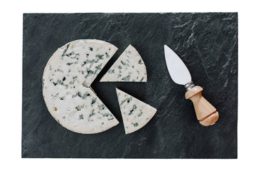 Round cheese with knife