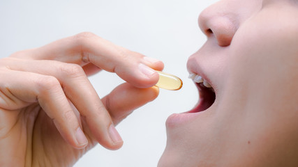 Women eating fish oil