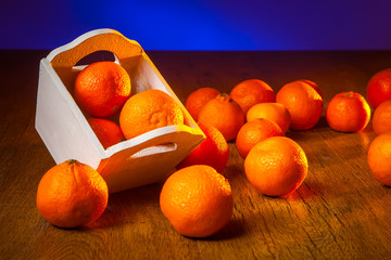 Tangerines ruffled on the table.