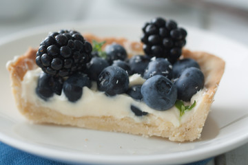 Piece of cake with berried and cream cheese