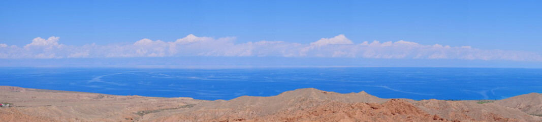 Panorama of the fairy-tale canyon and Issyk-Kul