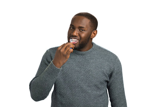 Handsome man brushing his teeth. Afro american man excited about brushing his teeth. Oral health care.
