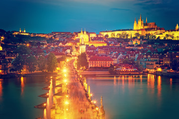 Fototapeta na wymiar View of Charles Bridge, Prague Castle and Vltava river in Prague, Czech Republic during blue hour. The world famous Prague and Europe landmark.