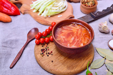 Traditional Ukrainian borsch in a round brown plate