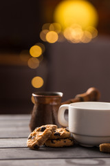 hot black coffee with cookies and beans in cafe
