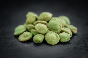 Portion of Wasabi coated Peanuts (selective focus)