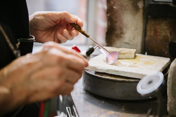 Art Jeweler Working in Studio