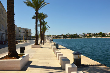 Naklejka premium Blue water of seafront of Brindisi port, Apulia, Italy