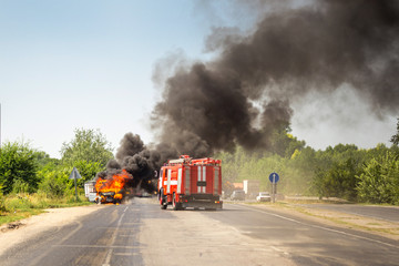 Burning motor vehicle after road accident