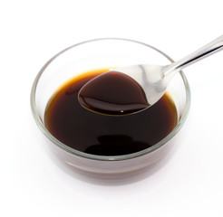 spoon lap oyster sauce on white background