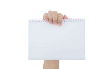 Hand holding an empty notepad (notebook) isolated on white background