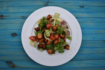 Fresh vegetable salad, healthy food, tomatoes and salad leaves. Healthy chicken salad with fresh vegetables