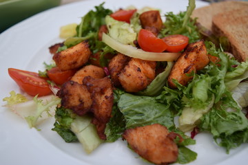 Fresh vegetable salad, healthy food, tomatoes and salad leaves. Healthy chicken salad with fresh vegetables