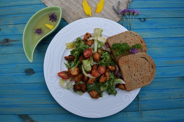 Fresh vegetable salad, healthy food, tomatoes and salad leaves. Healthy chicken salad with fresh vegetables