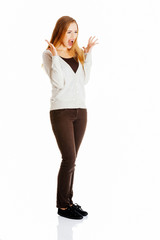 Fototapeta premium Beautiful positive and casual woman expressing surprise.