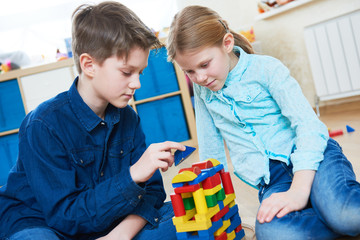 children playing with blocks indoors