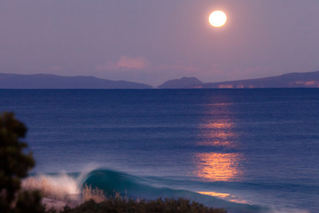 Full moon above sea