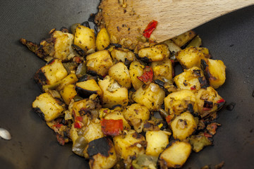 Slightly charred mixed mediterranean vegetables in a wok