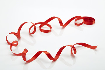 Red curly ribbon isolated on white