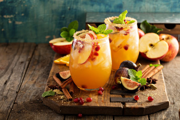 Fall sangria cocktail with apple, figs and orange