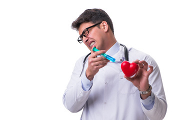 Young male cardiologist doctor holding a heart isolated on white