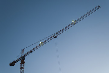 Tower crane against the sky, jib crane, view from below
