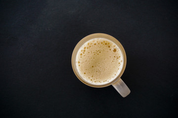 Tea with in a mug or popularly known as Teh Tarik isolated in white view from top.