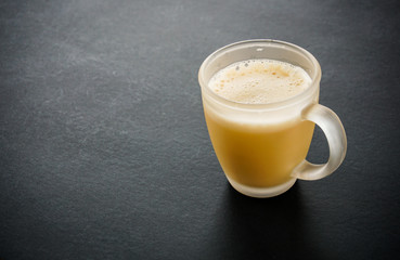 Tea with in a mug or popularly known as Teh Tarik isolated in white view from top.