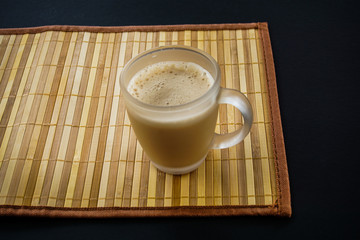Tea with in a mug or popularly known as Teh Tarik isolated in white view from top.