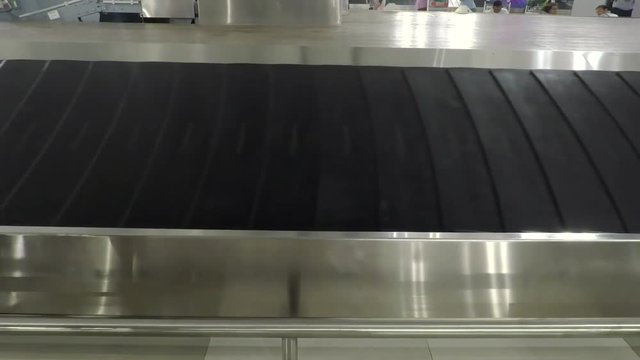 Video footage of empty baggage conveyor belt in the airport