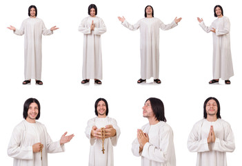 Young priest with bible isolated on white