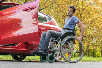 Naklejka premium Disabled or handicapped man is trying to getting to car.