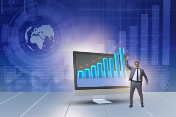 Businessman in economic forecasting concept with charts