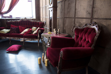 Beautiful antique room with red armchairs