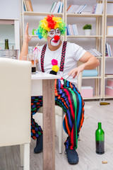 Drunk clown celebrating having a party at home
