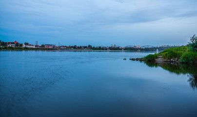 Obraz premium Grudziadz at night with Wisla river, Poland