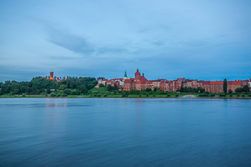 Obraz premium Grudziadz at night with Wisla river, Poland